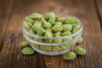 Peanuts (with Wasabi flavor) on vintage wooden background