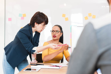 group of three multi generation of creative work place, modern style of work, entrepreneur group brainstorming