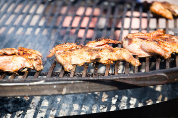 Pickled chicken fried on a large barbecue