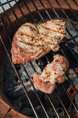 Roast pork steak on a charcoal stove.Steps to make a steak.