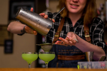 Bartender prepares a cocktail