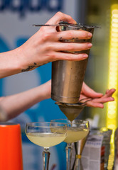 Bartender prepares a cocktail