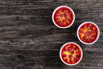 portions of  Cherry clafouti t in ceramic forms