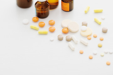 Composition of medicine bottles and pills  on white background
