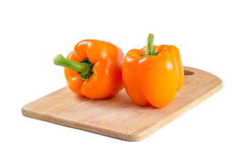 orange peppers on the Board isolated background