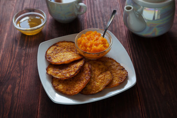 Pumpkin pancakes with honey and tea