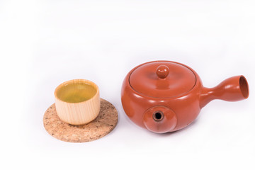 Hot green tea so delicious and teapot on white background  with clipping path.