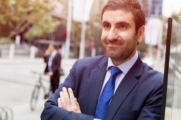 Fototapeta premium Portrait of handsome businessman outdoor