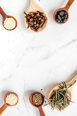 Flat lay vanilla, cinnamon, herb and spices on white kitchen background space for text