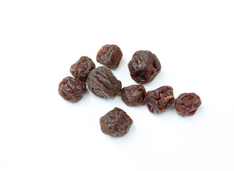 Dried plums isolated on a white background.