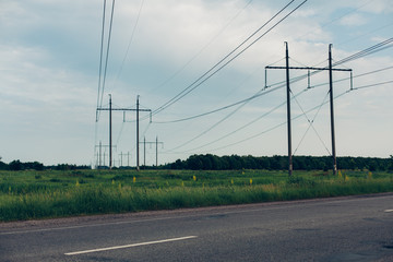 Heat haze rises as powerlines blur into the distance