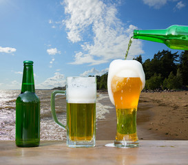 Pouring glass of beer from bottle