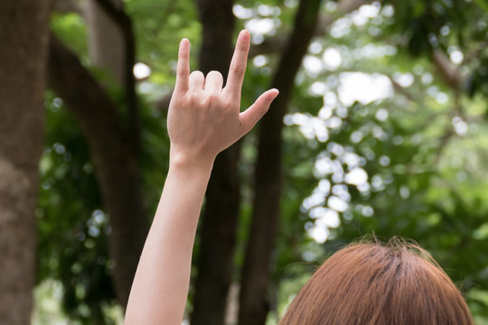 Female hand with I love you finger gesture. woman showing symbol sign language