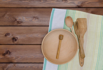 Wooden kitchen utensils and kitchen towel