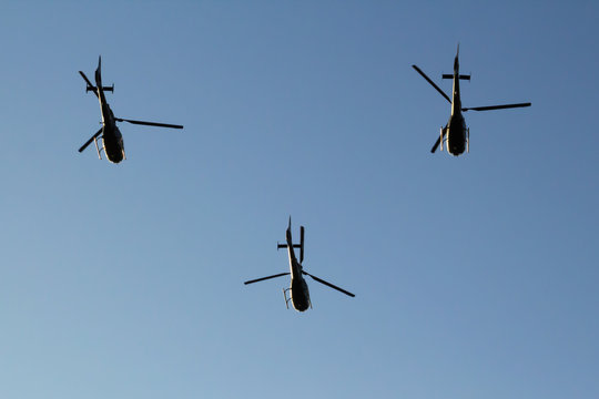 Three Serbian Air Force helicopters flying in formation on parade in Belgrade