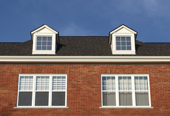 Fototapeta na wymiar house roof residential skylight dormer red brick