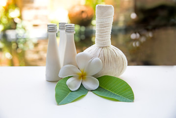 Fototapeta na wymiar Thai Spa Treatments and massage on wooden white nature background. Healthy Concept