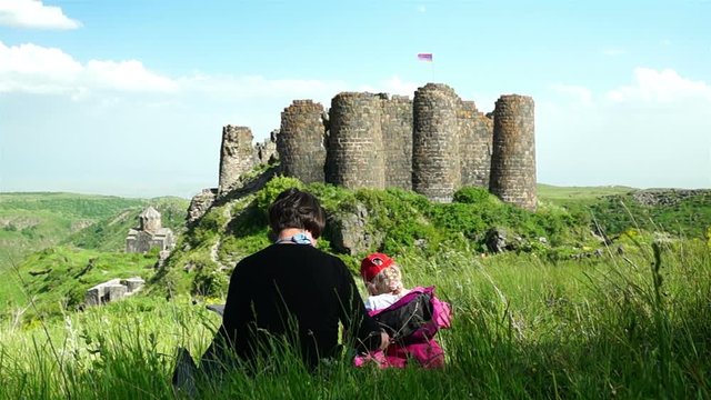 Mother and daughter draw in historical place