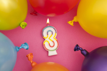 Happy Birthday number 3 celebration candle with colorful balloons