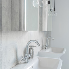 Two sinks in concrete bathroom