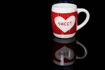 Heart on coffee cup.