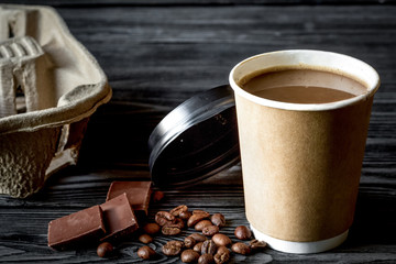coffee cup to go at wooden background