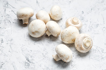 Champignon on a light background. Fresh champignons on a  background