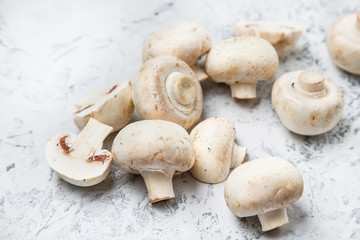 Champignon on a light background. Fresh champignons on a  background