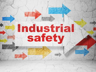 Construction concept: arrow with Industrial Safety on grunge wall background