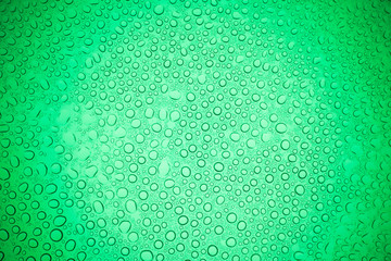 Rain droplets on green glass background, Water drops on glass.