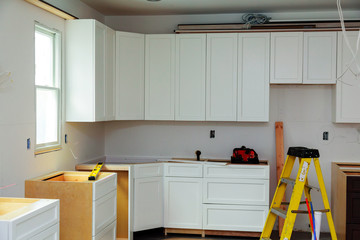 Custom kitchen cabinets in various stages of installation