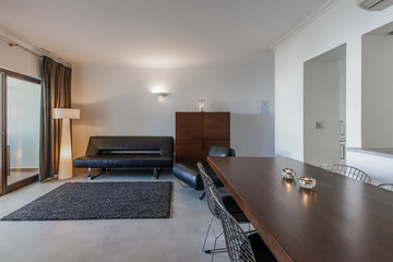 Modern apartment with white walls and light grey floor