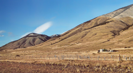 Morning sunrise Andes mountains landscape in Patagonia Argentina, South America. Rustic gaucho farm. Autumn landscape
