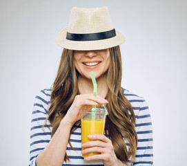 Young woman drinking juice with straw.