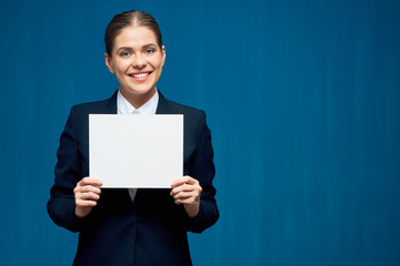 Smiling business woman holding sign card.