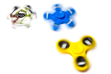 Hand spinner spinning on white background