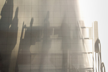 Blurry shadows of people Stand in line With the evening light
