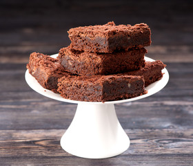 Chocolate brownie cake on a wooden background