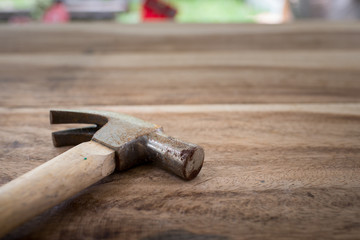 Old hammer on wood