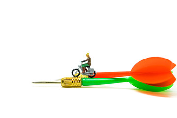 Miniature people, traveler riding on arrow isolated on white background using adventure concept
