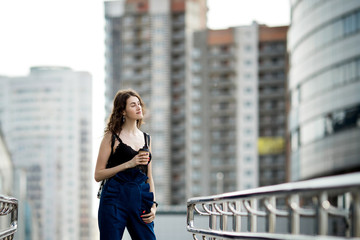 young beautiful stylish hipster woman  drinking coffee in paper cup