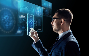 businessman with tablet pc and virtual screens