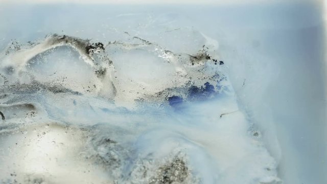 Abstract footage of ice and ink freezing. (Reversed timlapse) 