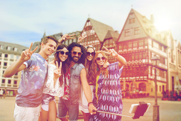 happy hippie friends taking selfie in frankfurt