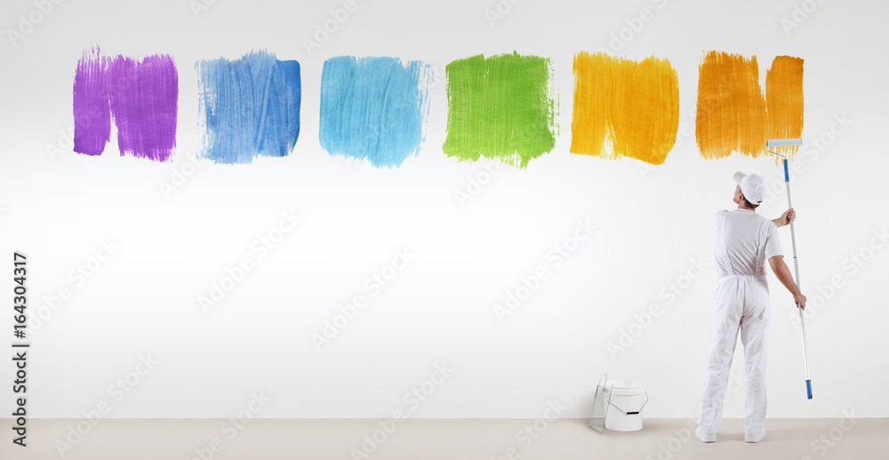 Wall mural painter man painting varied colors symbol isolated on blank white wall background, banner web