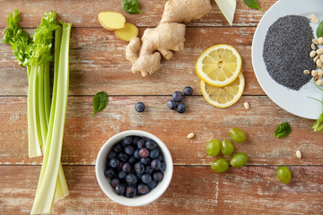 fruits, berries and vegetables on wooden table