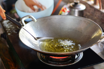 Close-up hot oil and boiling in pan
