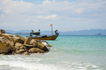 Naklejka premium Colorful fishing boats in Vietnam, next to the fishing village.