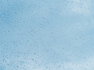 Drops of rain on the car window. Abstract background.