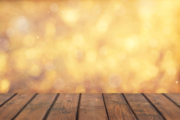 Wood table top on golden bokeh abstract background